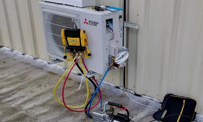 Technician testing a residential heat pump system