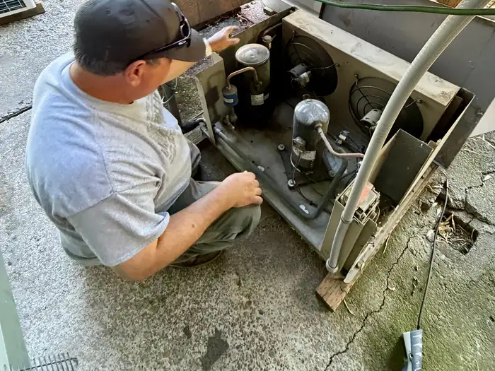 Mike servicing an outdoor commercial condensing unit
